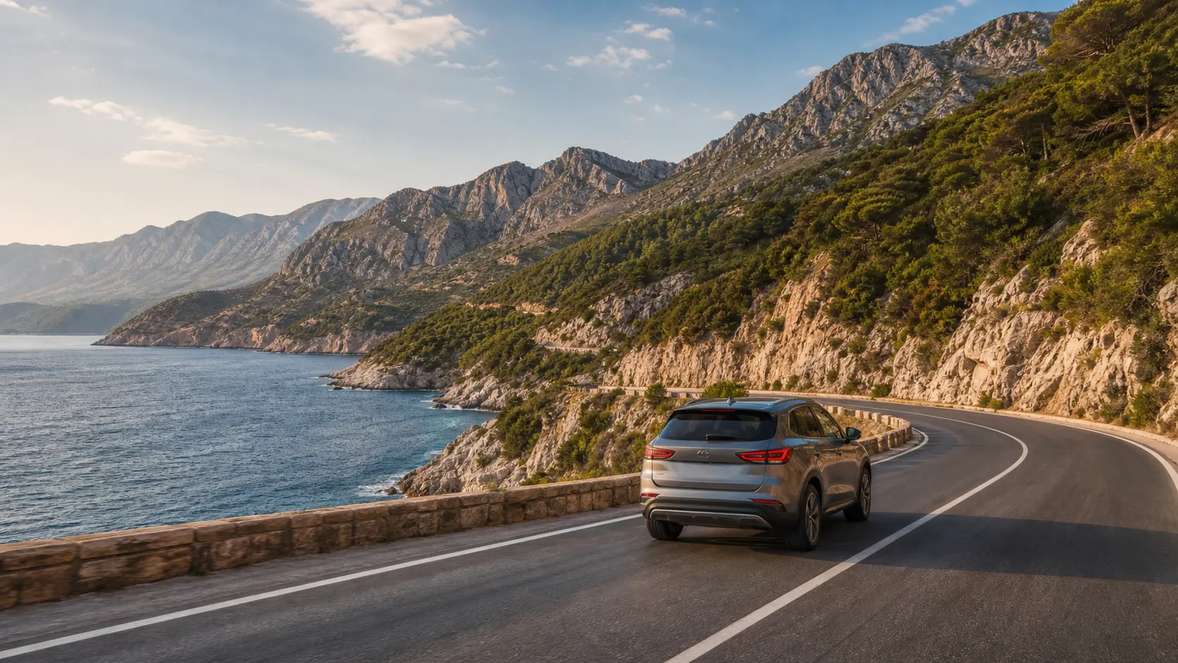 Rental car on an Adriatic coastal road near Bar in Montenegro