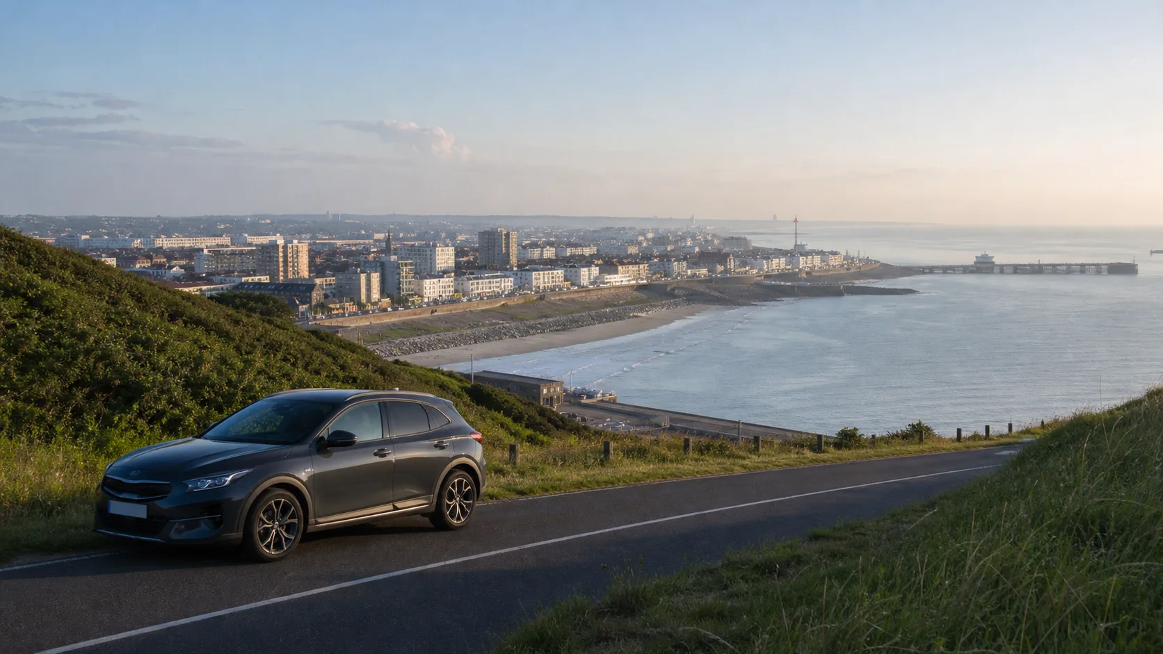 Rental car on a coastal road overlooking Calais in northern France