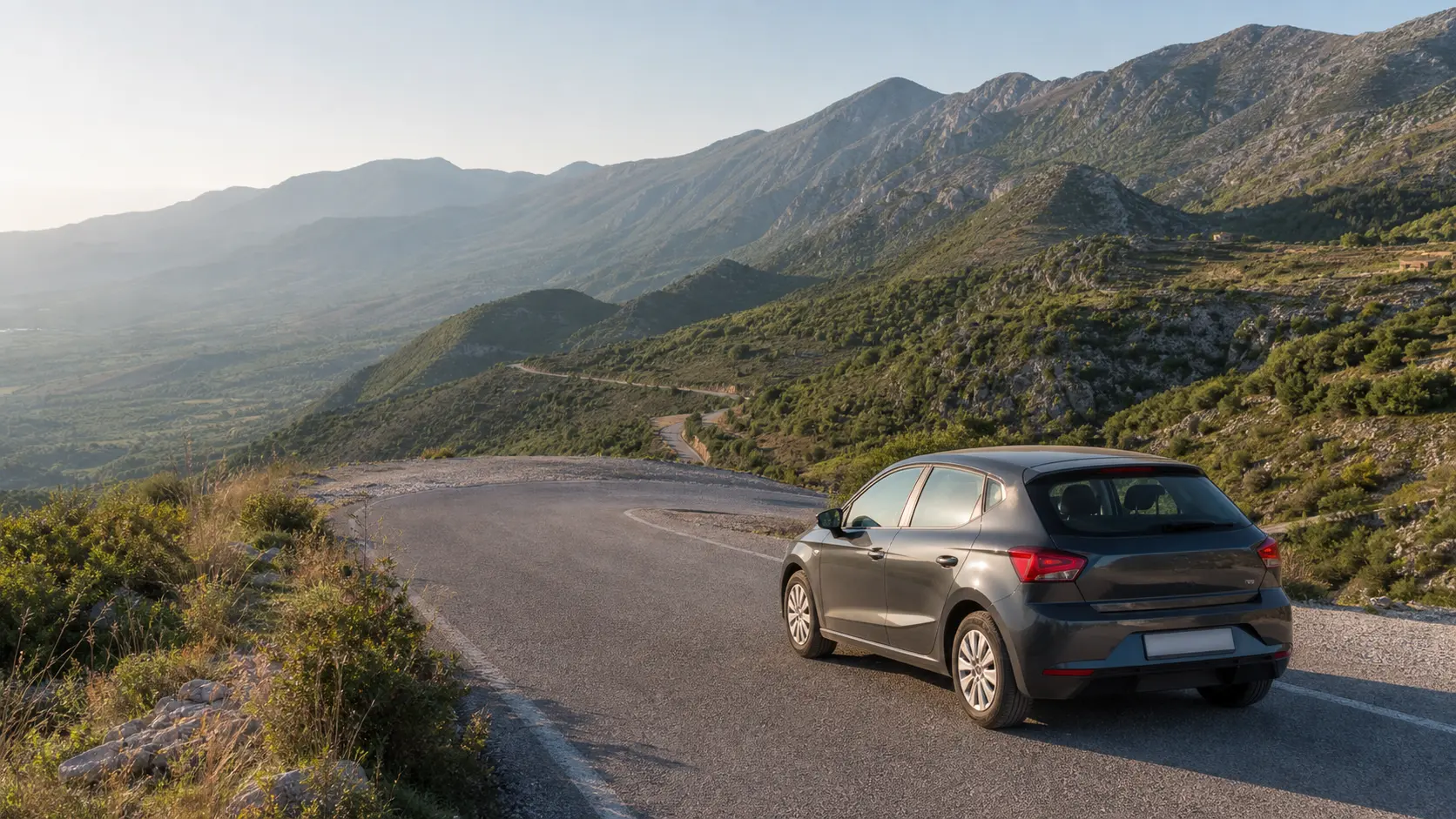 Rental car on a mountain road near Gjirokaster in southern Albania