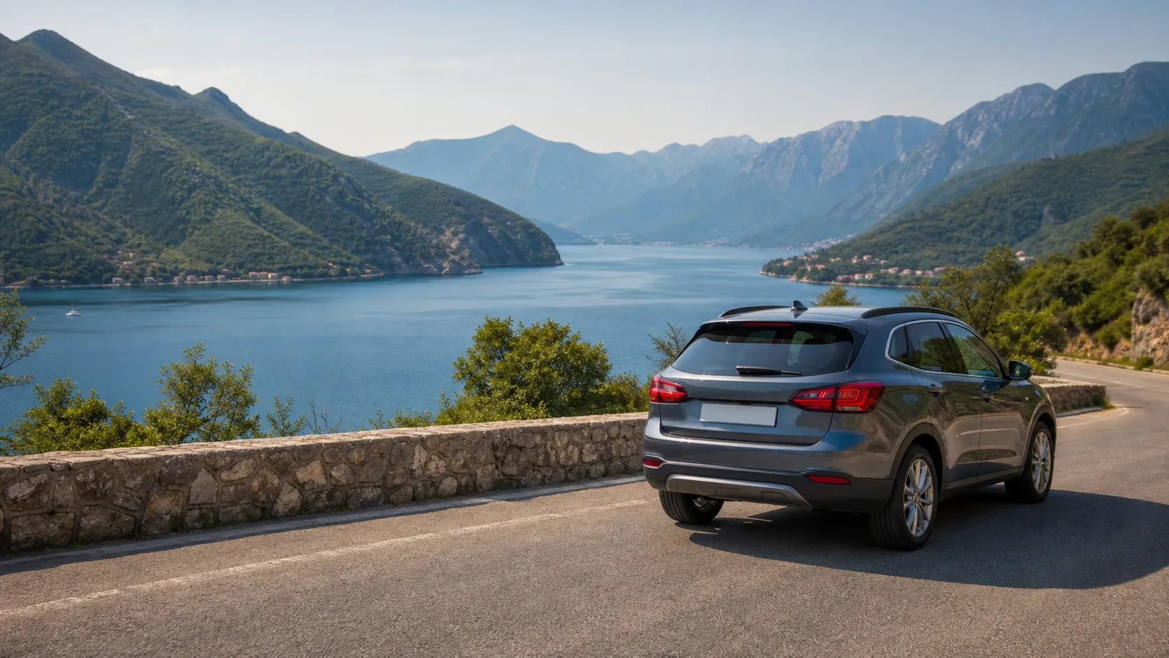 Rental car on a coastal road above the Bay of Kotor near Herceg Novi
