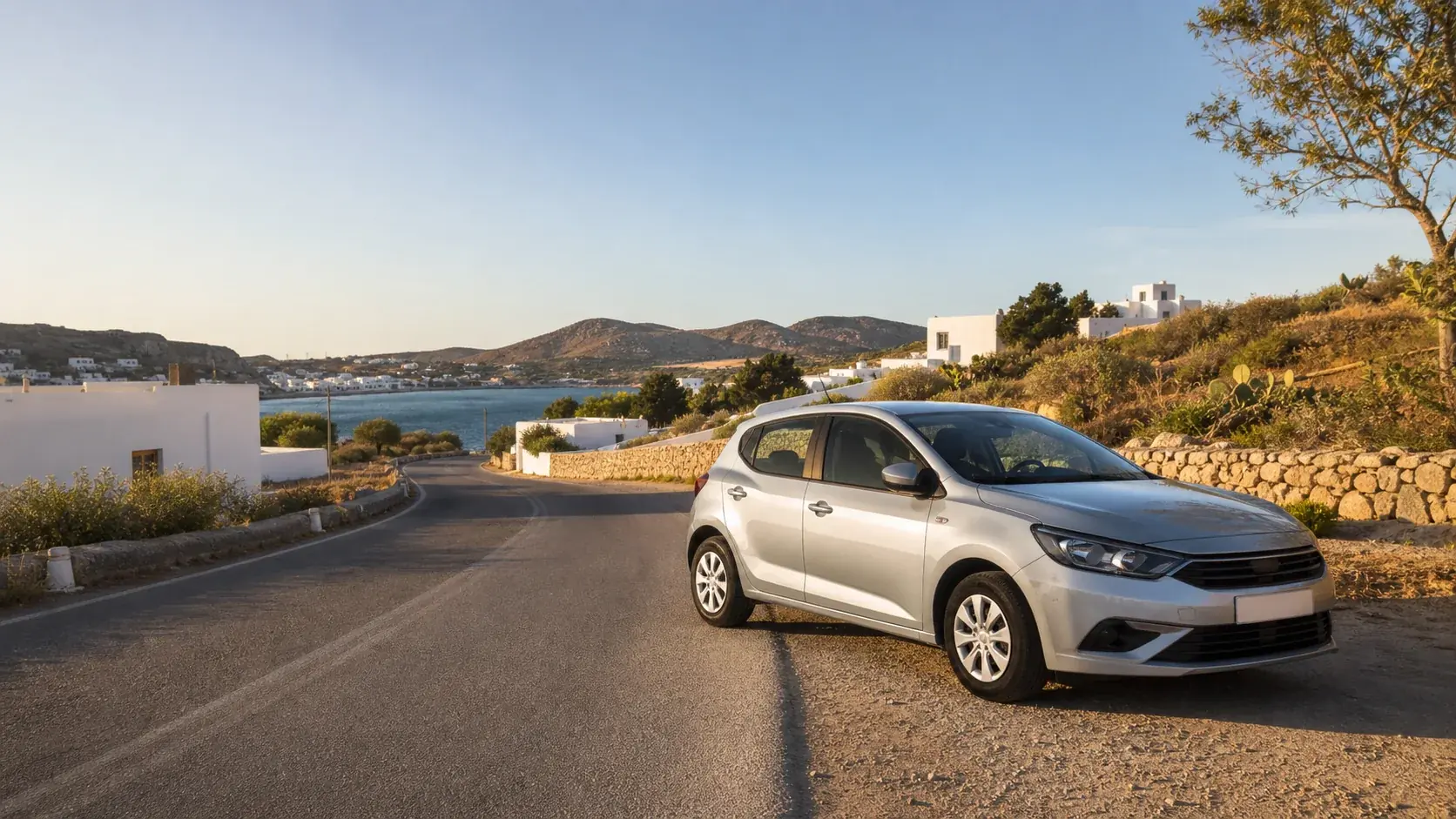 Illustrative rental car on a road above Livadi port and the Aegean on Patmos