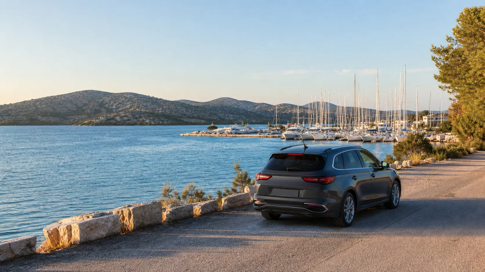 Rental car on a coastal road beside a Dalmatian marina near Sibenik Port