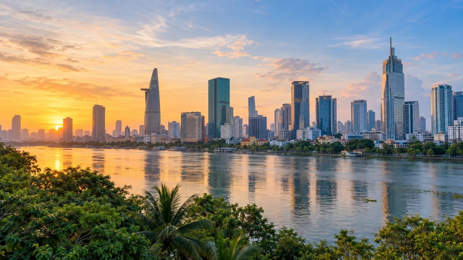 City skyline above a river at warm sunset